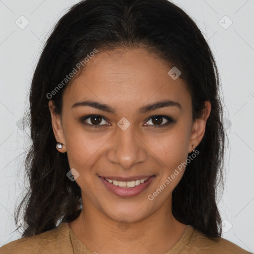 Joyful latino young-adult female with long  brown hair and brown eyes