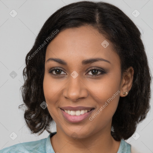 Joyful black young-adult female with medium  brown hair and brown eyes