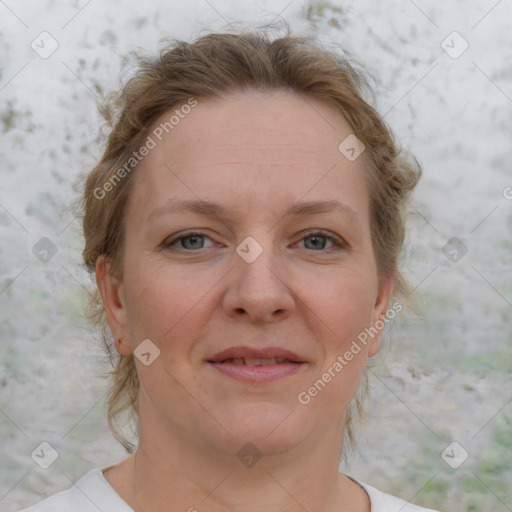 Joyful white young-adult female with medium  brown hair and blue eyes