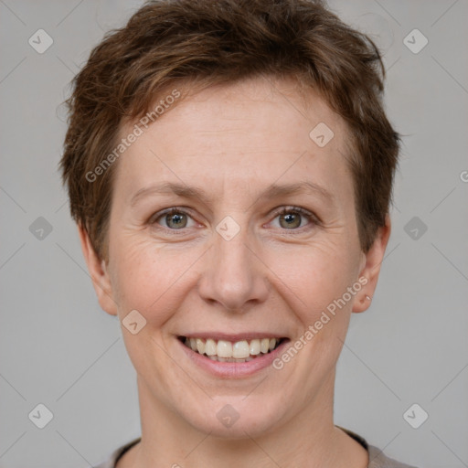 Joyful white adult female with short  brown hair and brown eyes