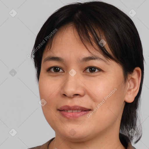 Joyful white young-adult female with medium  brown hair and brown eyes