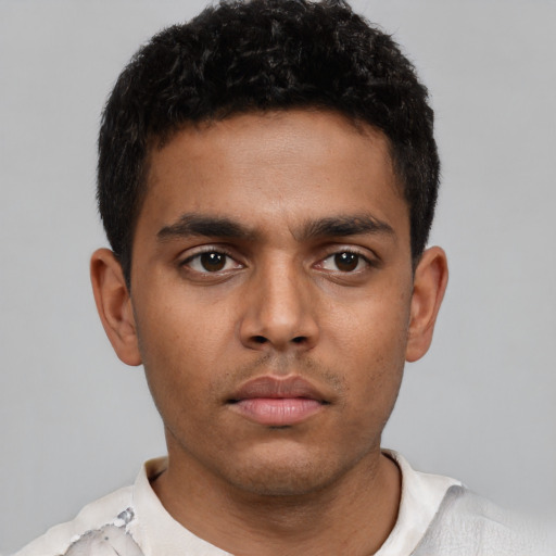 Neutral latino young-adult male with short  black hair and brown eyes