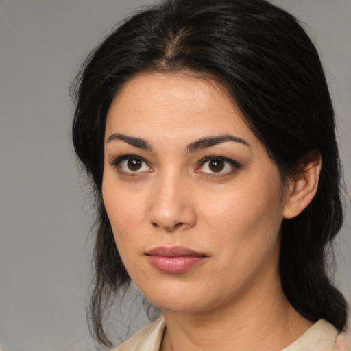 Neutral latino young-adult female with medium  brown hair and brown eyes