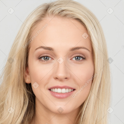 Joyful white young-adult female with long  brown hair and blue eyes