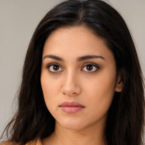 Neutral latino young-adult female with long  brown hair and brown eyes