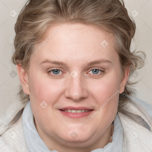 Joyful white young-adult female with medium  brown hair and blue eyes