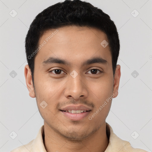 Joyful latino young-adult male with short  black hair and brown eyes