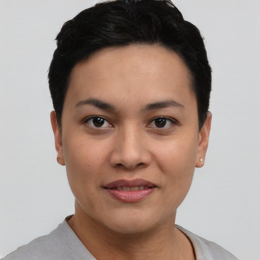 Joyful asian young-adult female with short  black hair and brown eyes