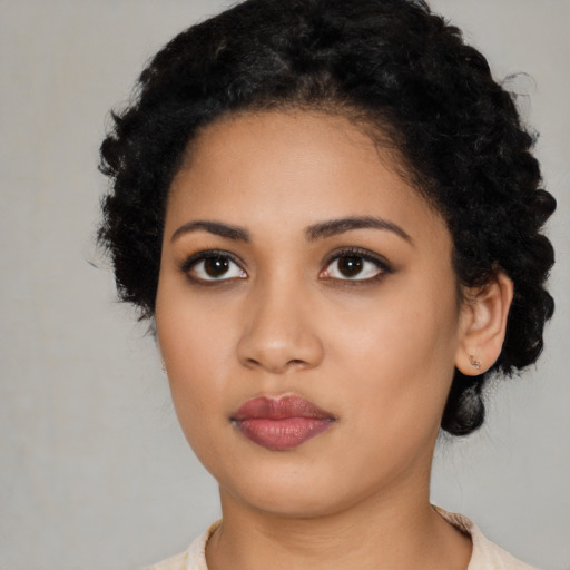 Neutral latino young-adult female with medium  black hair and brown eyes