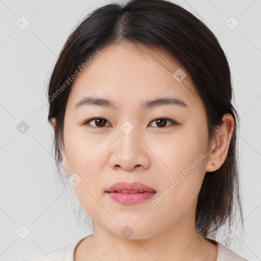 Joyful asian young-adult female with medium  brown hair and brown eyes