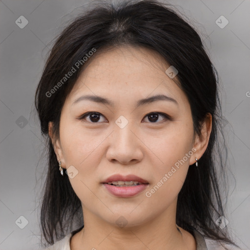 Joyful asian young-adult female with medium  brown hair and brown eyes