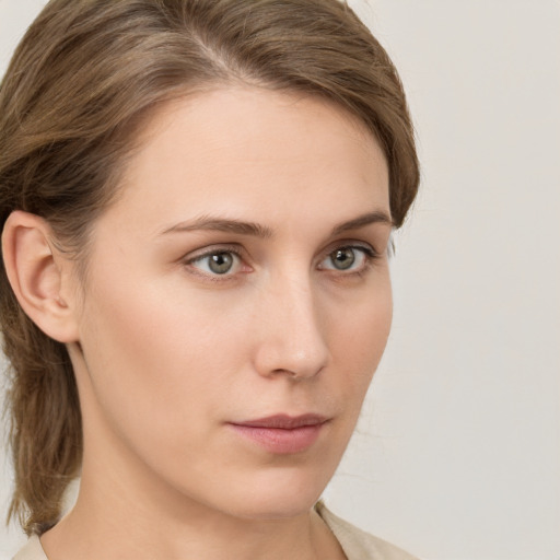 Neutral white young-adult female with medium  brown hair and green eyes