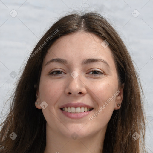 Joyful white young-adult female with long  brown hair and grey eyes