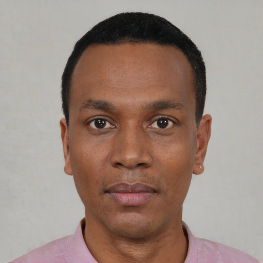 Neutral black young-adult male with short  black hair and brown eyes