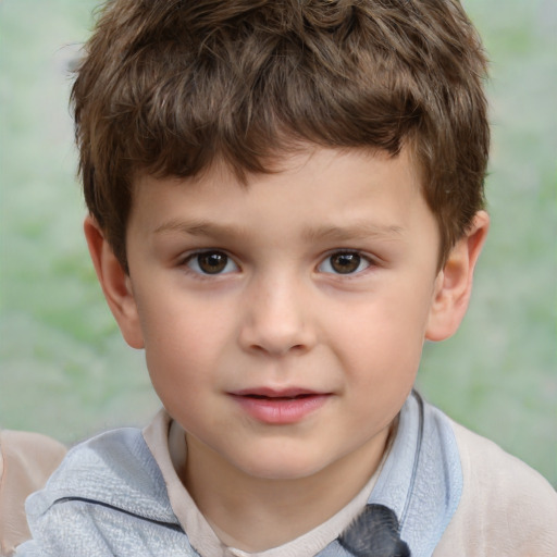 Joyful white child male with short  brown hair and brown eyes