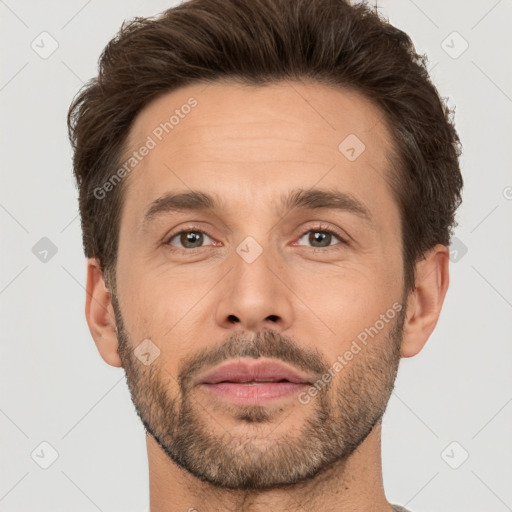 Joyful white adult male with short  brown hair and brown eyes