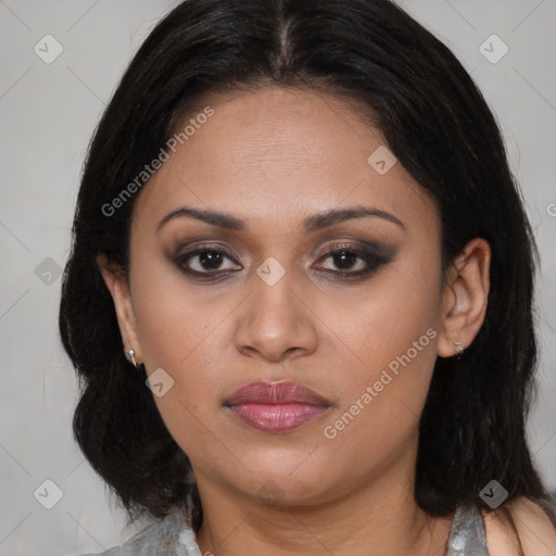 Joyful latino young-adult female with medium  brown hair and brown eyes