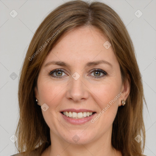 Joyful white adult female with long  brown hair and grey eyes