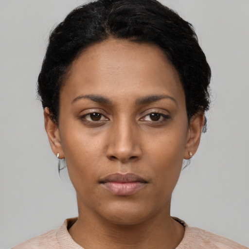 Neutral black young-adult female with short  black hair and brown eyes