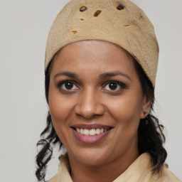 Joyful black young-adult female with medium  brown hair and brown eyes