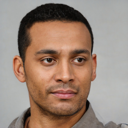 Neutral latino young-adult male with short  black hair and brown eyes