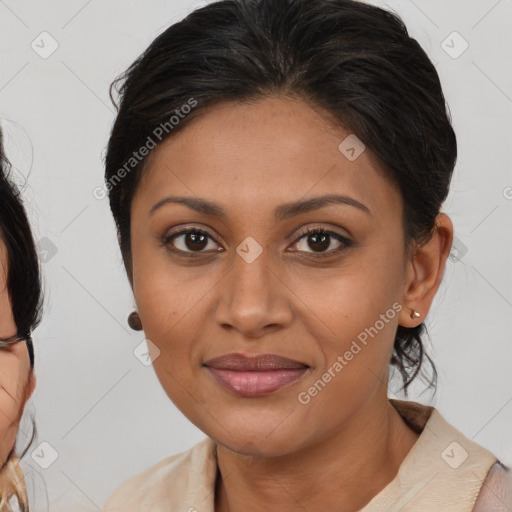 Joyful black young-adult female with medium  brown hair and brown eyes