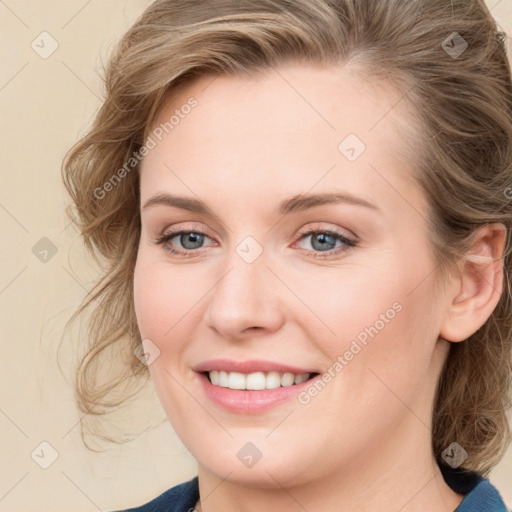 Joyful white young-adult female with medium  brown hair and blue eyes