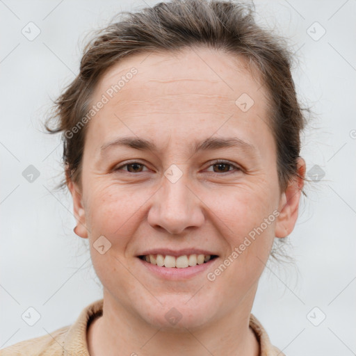 Joyful white adult female with short  brown hair and brown eyes