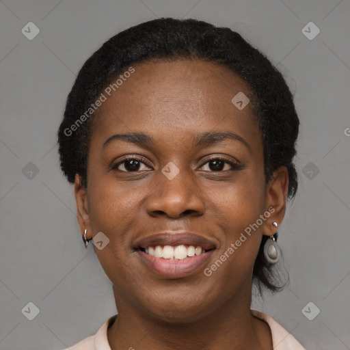 Joyful black young-adult female with short  black hair and brown eyes