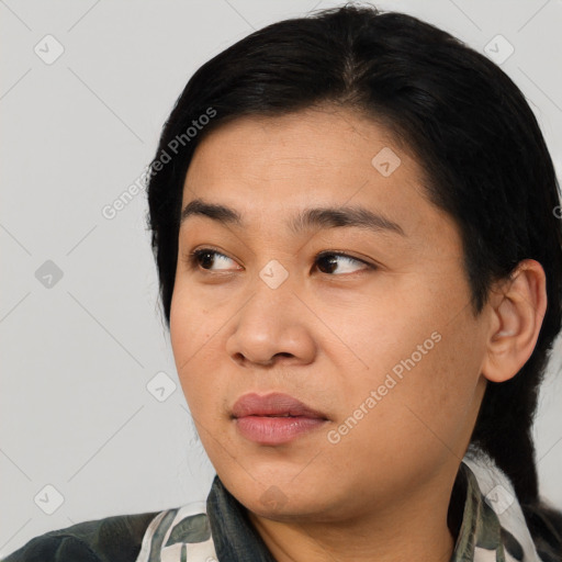 Joyful asian young-adult female with medium  black hair and brown eyes