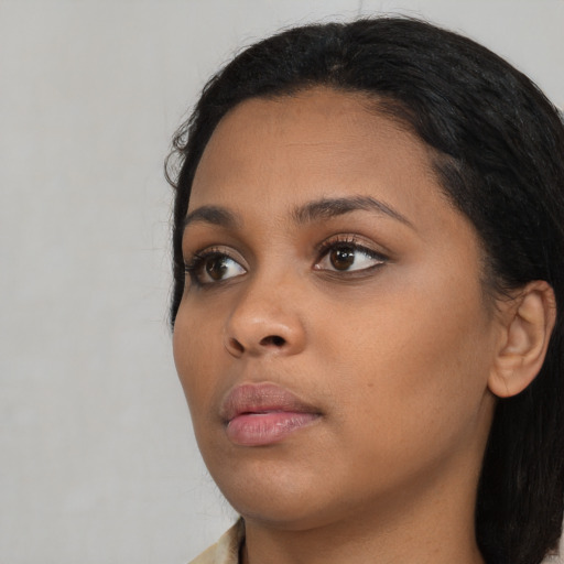 Neutral black young-adult female with long  black hair and brown eyes