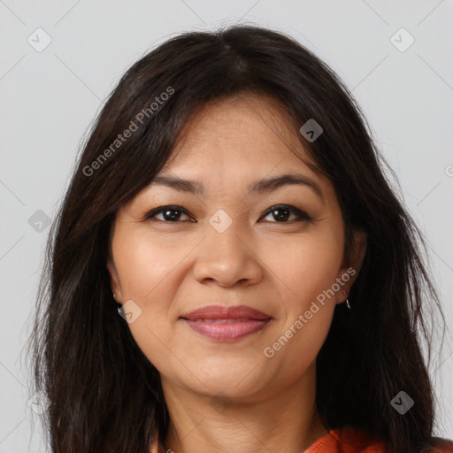 Joyful latino young-adult female with medium  brown hair and brown eyes