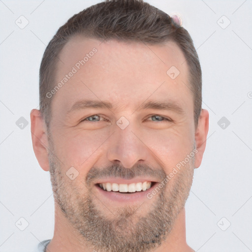 Joyful white adult male with short  brown hair and brown eyes