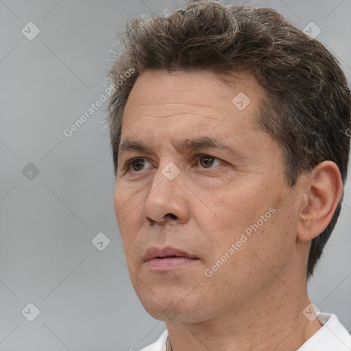 Neutral white adult male with short  brown hair and brown eyes