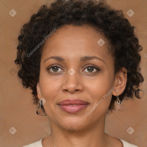 Joyful black adult female with medium  brown hair and brown eyes