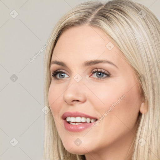 Joyful white young-adult female with long  brown hair and blue eyes