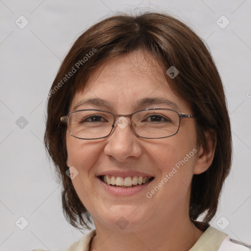 Joyful white adult female with medium  brown hair and brown eyes