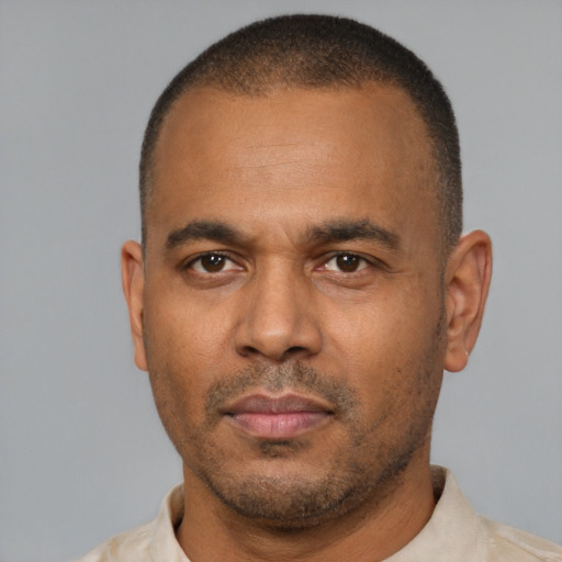Neutral latino adult male with short  black hair and brown eyes