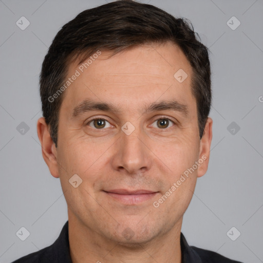 Joyful white adult male with short  brown hair and brown eyes