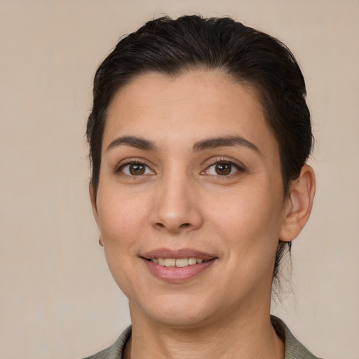 Joyful white young-adult female with short  brown hair and brown eyes