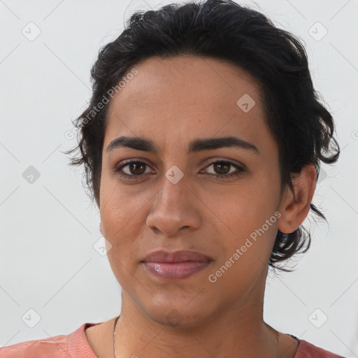 Joyful latino young-adult female with medium  black hair and brown eyes