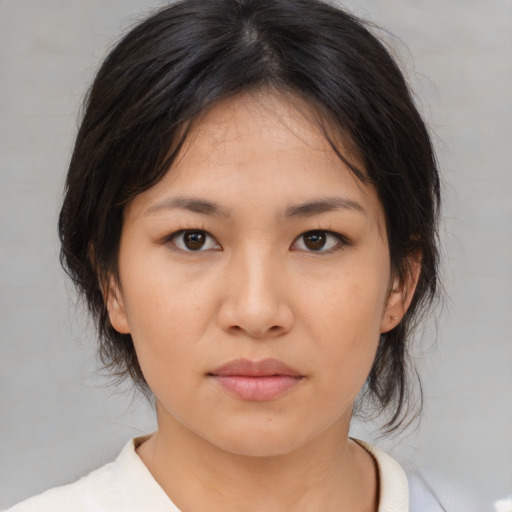 Neutral asian young-adult female with medium  brown hair and brown eyes