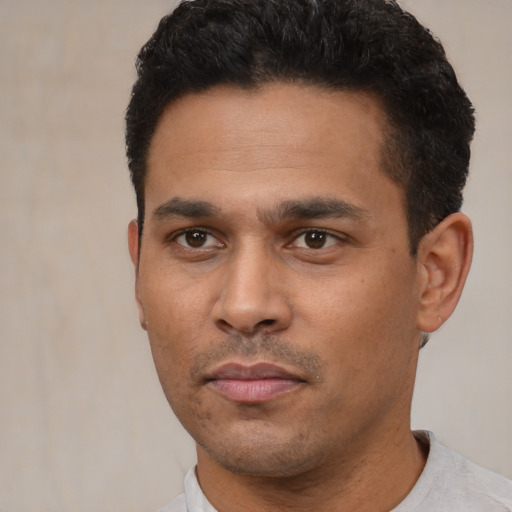 Neutral latino young-adult male with short  black hair and brown eyes