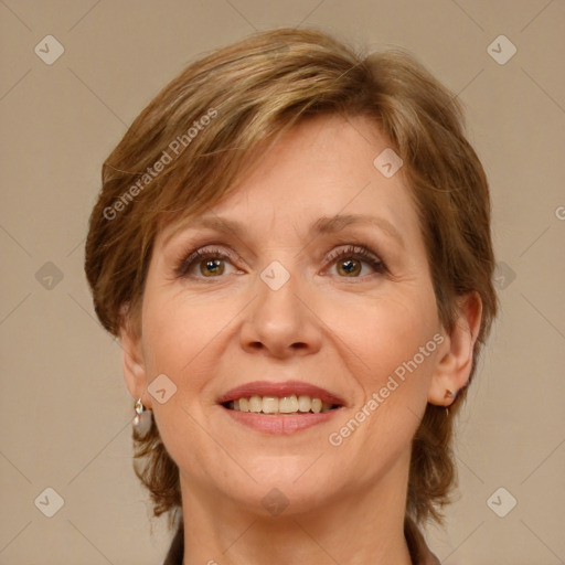 Joyful white adult female with medium  brown hair and green eyes