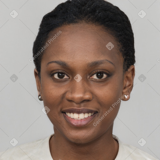 Joyful black young-adult female with short  black hair and brown eyes