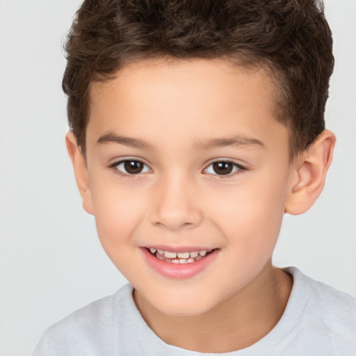 Joyful white child male with short  brown hair and brown eyes