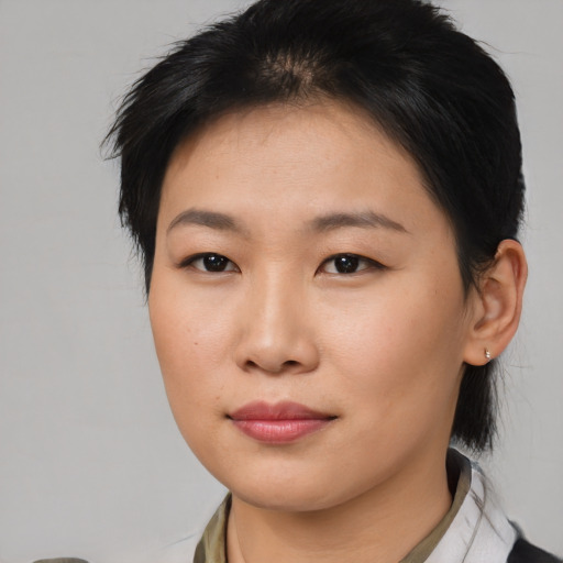 Neutral asian young-adult female with medium  brown hair and brown eyes