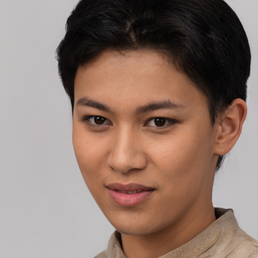 Joyful asian young-adult female with short  brown hair and brown eyes
