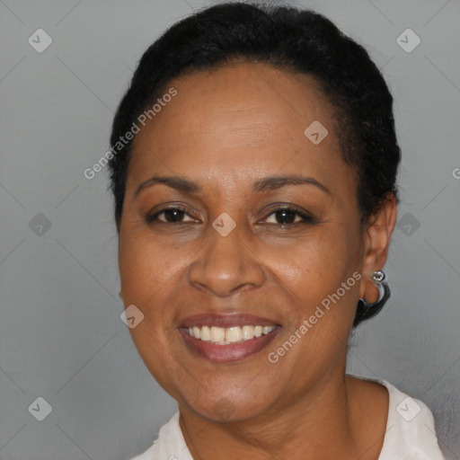 Joyful black adult female with short  brown hair and brown eyes