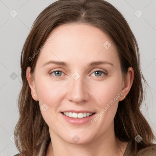 Joyful white young-adult female with long  brown hair and grey eyes